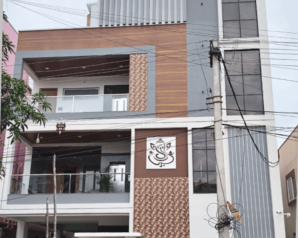 The modern facade of GLN Reddy Residency in Nagaram, a 4BHK triplex independent house built by Nice Design & nice Constructions.