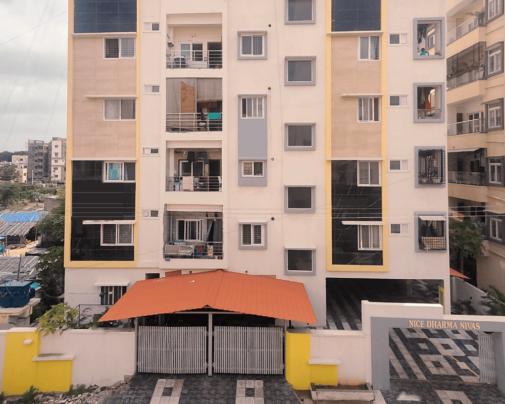 The completed facade of NICE DHARMA NIVAS, a residential apartment complex in Sainikpuri, built by Nice Design & nice Constructions.